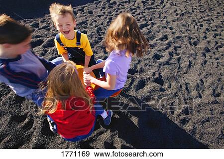 Stock Photo - Children playing on in the park. Fotosearch
