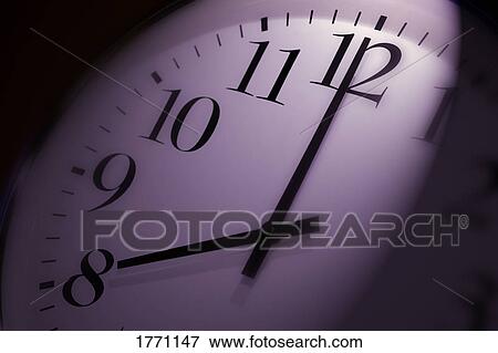 Stock Photo - Clock face showing 8 o'clock. Fotosearch