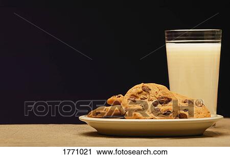 Cookies and glass of milk View Large Photo Image Stock Image - Cookies and glass of milk. Fotosearch