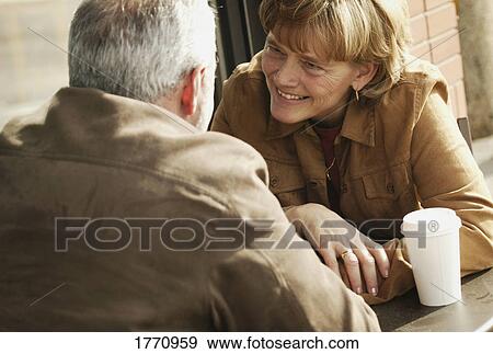Stock Photo - Couple talking over coffee. Fotosearch