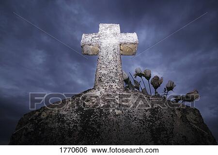 Stock Photograph - Cross headstone. Fotosearch