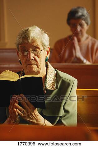 Elderly lady reading bible View Large Photo Image Stock Photograph - Elderly lady reading bible. Fotosearch