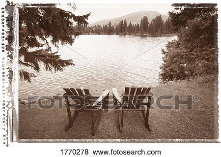 Stock Photo - Empty chairs on waterfront. Fotosearch