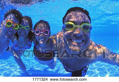 Family group in swimming pool View Large Photo Image Picture - Family group in swimming pool. Fotosearch