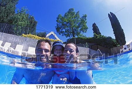 Family group in swimming pool View Large Photo Image Stock Photo - Family group in swimming pool. Fotosearch