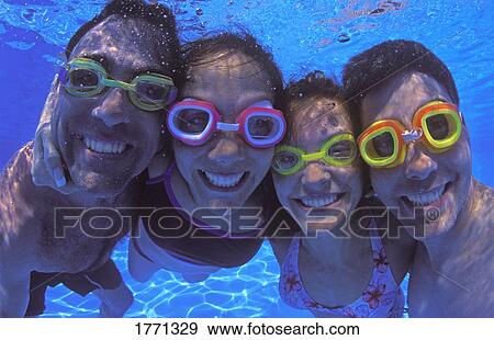 Stock Photo - family group in swimming pool. Fotosearch