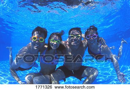 Family group in swimming pool View Large Photo Image Stock Photograph - Family group in swimming pool. Fotosearch