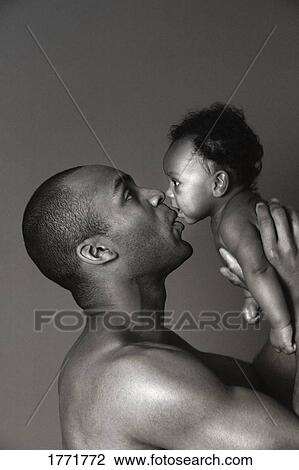 Father holding baby View Large Photo Image Stock Image - Father holding baby. Fotosearch