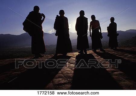 Stock Photo - Five Buddhist monks in silhouette. Fotosearch