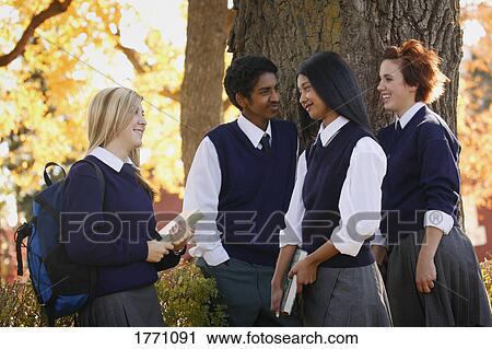 Stock Image - Group of students hanging out. Fotosearch