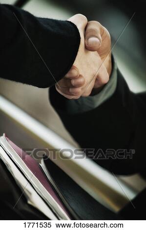 Stock Photography - Hand shake. Fotosearch