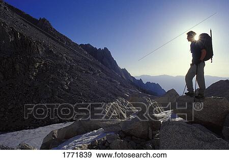 Hiker on boulder View Large Photo Image Stock Photo - Hiker on boulder. Fotosearch