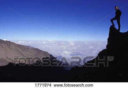 Hiker on rock View Large Photo Image Picture - Hiker on rock. Fotosearch