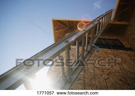 Ladder up to new roof View Large Photo Image Stock Photo - Ladder up to new roof. Fotosearch