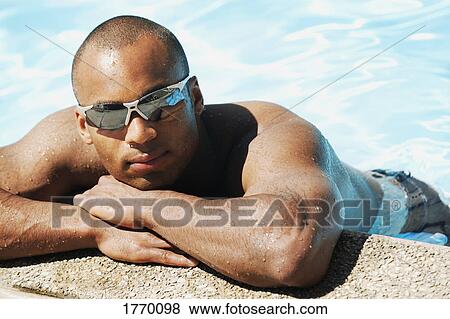 male with sunglasses in pool View Large Photo Image Stock Photo - male with sunglasses in pool. Fotosearch