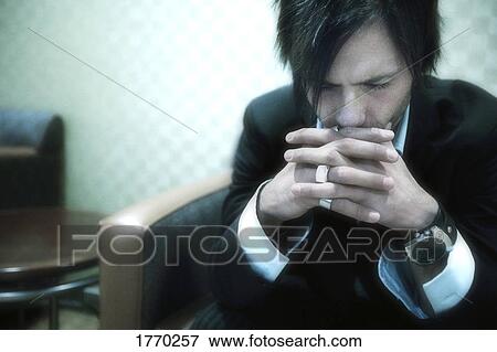 Stock Photo - Man deep in thought. Fotosearch