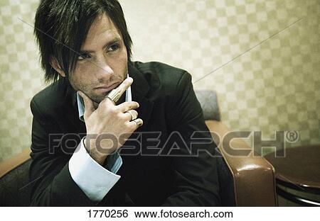 Stock Photograph - Man in deep thought. Fotosearch