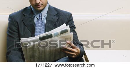 Man reading the newspaper View Large Photo Image Stock Photo - Man reading the newspaper. Fotosearch