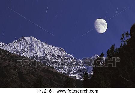 Moonlit snowy mountain View Large Photo Image Stock Image - Moonlit snowy mountain. Fotosearch