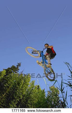 Stock Photography - Mountain bike stunt. Fotosearch