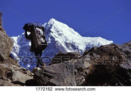 Mountain climber walking on mountain View Large Photo Image Stock Image - Mountain climber walking on mountain. Fotosearch