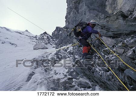 Mountaineer climbing mountain View Large Photo Image Stock Image - Mountaineer climbing mountain. Fotosearch