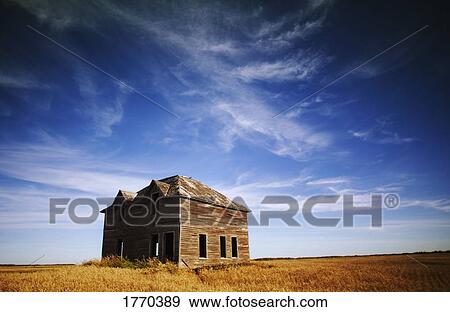 Stock Photo - Old building in field. Fotosearch