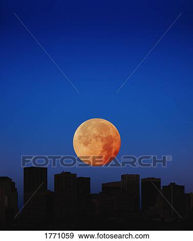 Orange moon in dark sky View Large Photo Image Stock Photo - Orange moon in dark sky. Fotosearch