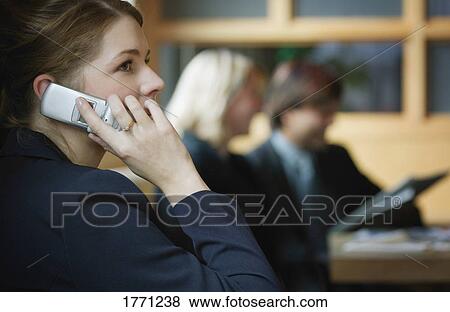 Stock Photo - Professional woman on mobile telephone. Fotosearch