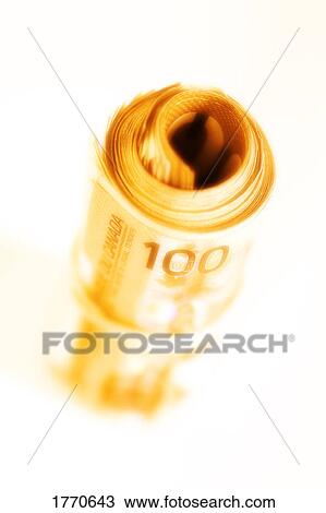 Stock Image - Roll of Canadian one hundred dollar bills. Fotosearch