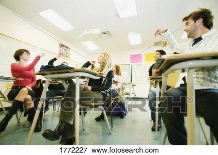 Students having paper fight View Large Photo Image Stock Photo - Students having paper fight. Fotosearch