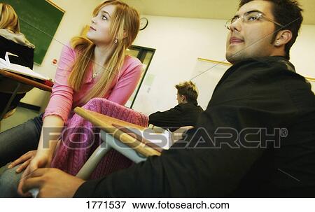 Students passing note in classroom View Large Photo Image Stock Photo - Students passing note in classroom. Fotosearch