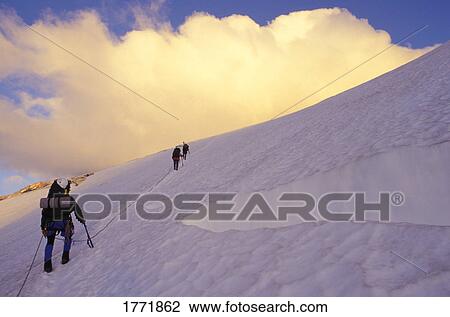 Stock Image - Team of mountaineers. Fotosearch