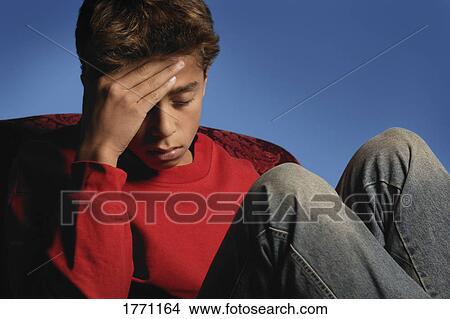 Picture - Teenage boy in thought. Fotosearch