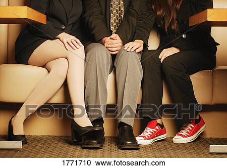 Stock Image - Three people waiting. Fotosearch