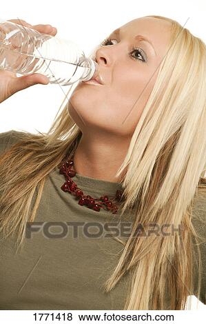 Stock Photo - Woman drinking bottled water. Fotosearch