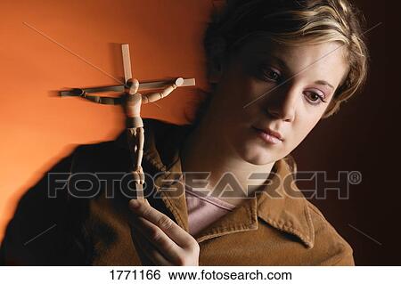 Woman with symbol of Crucifixion View Large Photo Image Stock Photograph - Woman with symbol of Crucifixion. Fotosearch