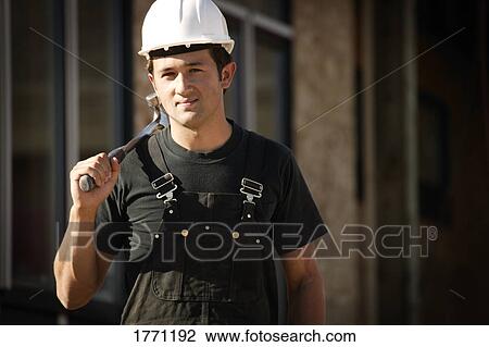 Worker with hammer View Large Photo Image Stock Image - Worker with hammer. Fotosearch