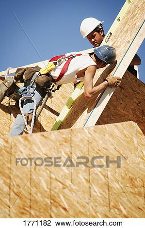 Workers building View Large Photo Image Stock Image - Workers building. Fotosearch