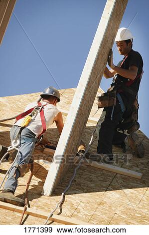 Stock Photo - Workers building. Fotosearch