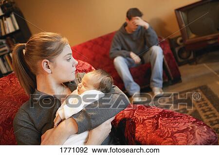 Young couple with baby View Large Photo Image Stock Image - Young couple with baby. Fotosearch