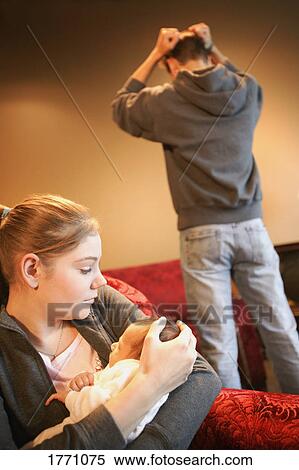 Young couple with new baby View Large Photo Image Stock Photography - Young couple with new baby. Fotosearch