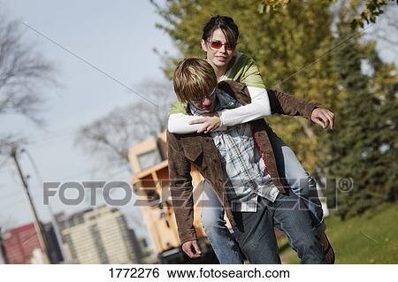 Stock Photograph - Young fashionable couple in casual dress. Fotosearch
