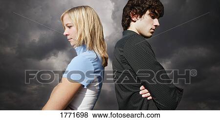 Young teen couple back to back View Large Photo Image Stock Photo - Young teen couple back to back. Fotosearch