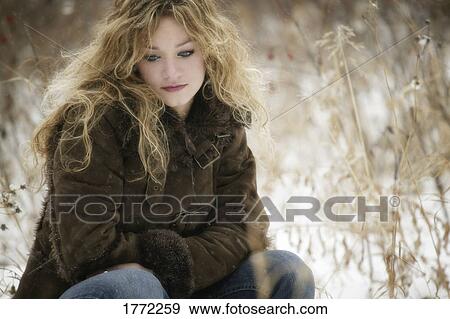 Young woman alone thinking View Large Photo Image Stock Photo - Young woman alone thinking. Fotosearch
