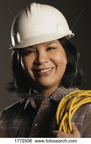 Stock Photograph - Aboriginal female electrician. Fotosearch