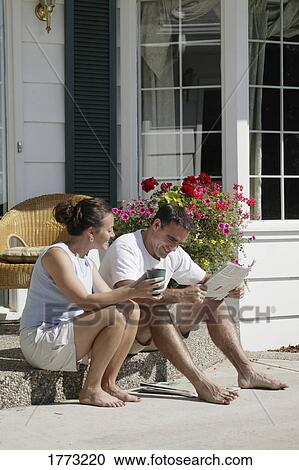 Adult couple relaxing in the sun View Large Photo Image Stock Image - Adult couple relaxing in the sun. Fotosearch