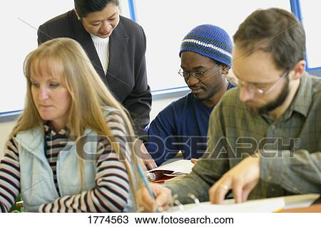 Adult students working View Large Photo Image Stock Image - Adult students working. Fotosearch