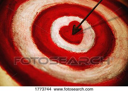 Arrow in heart target View Large Photo Image Picture - Arrow in heart target. Fotosearch
