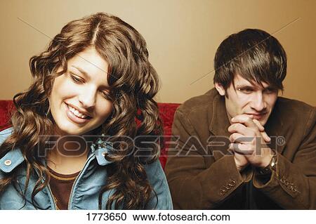 Stock Image - Attractive couple pondering. Fotosearch